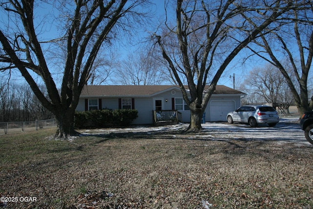 ranch-style house with a front lawn and a garage