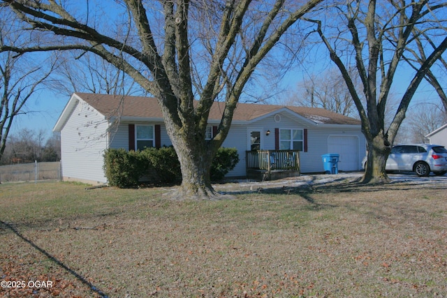 single story home with a garage and a front lawn