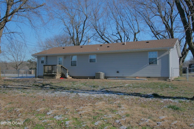 rear view of property with cooling unit