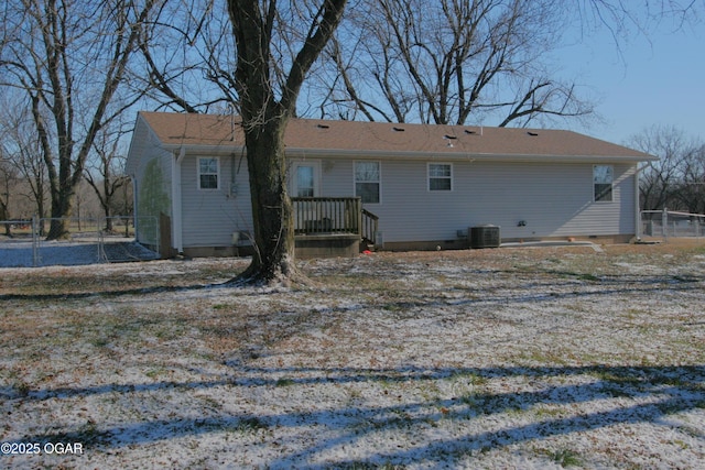 back of house with central air condition unit