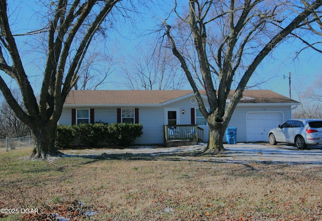 single story home with a garage and a front yard