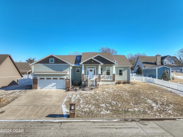 craftsman-style house with covered porch and a garage