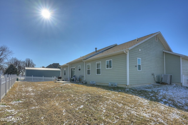 back of property with central air condition unit