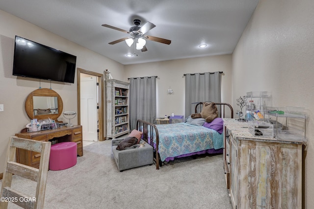 bedroom featuring light carpet and ceiling fan