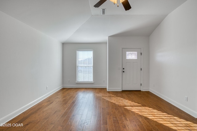 entrance foyer featuring ceiling fan, wood-type flooring, and lofted ceiling