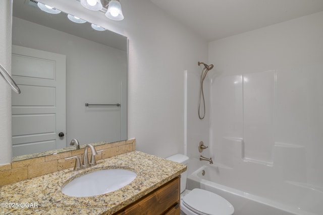 full bathroom with shower / bathing tub combination, vanity, and toilet