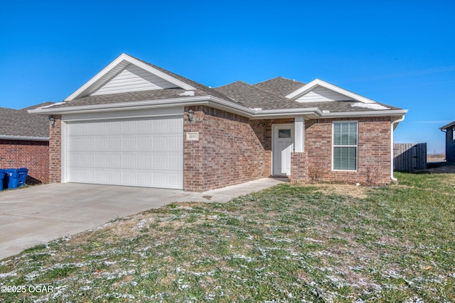 ranch-style home featuring a front yard and a garage