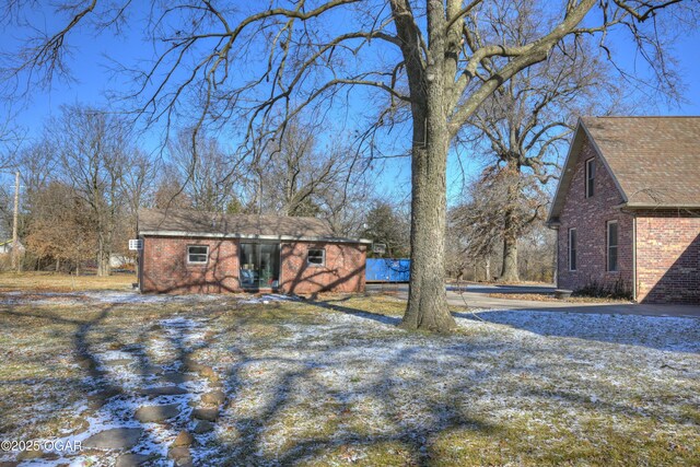 exterior space featuring an outbuilding