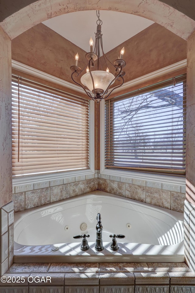 bathroom featuring tiled bath