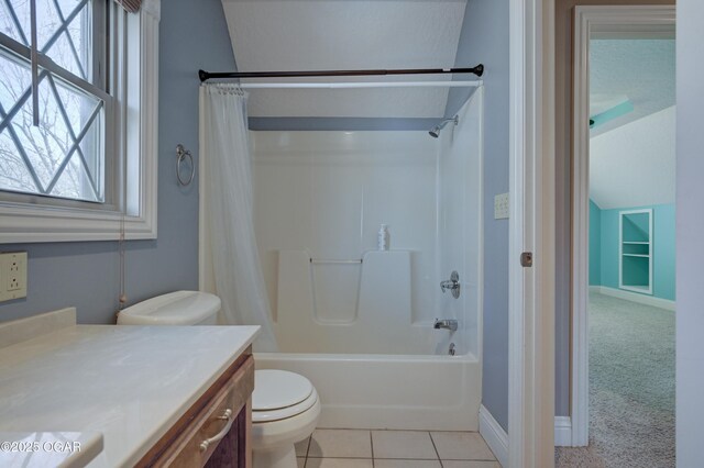 full bathroom featuring tile patterned flooring, vanity, shower / bath combination with curtain, and toilet