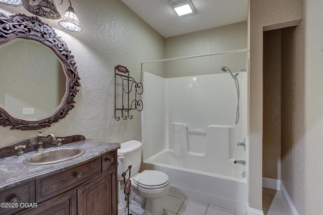 full bathroom featuring vanity, tile patterned flooring, toilet, a textured ceiling, and shower / bathtub combination