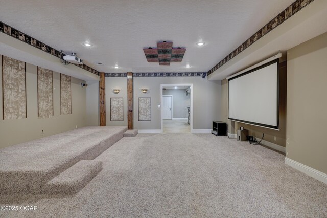 carpeted home theater with a textured ceiling