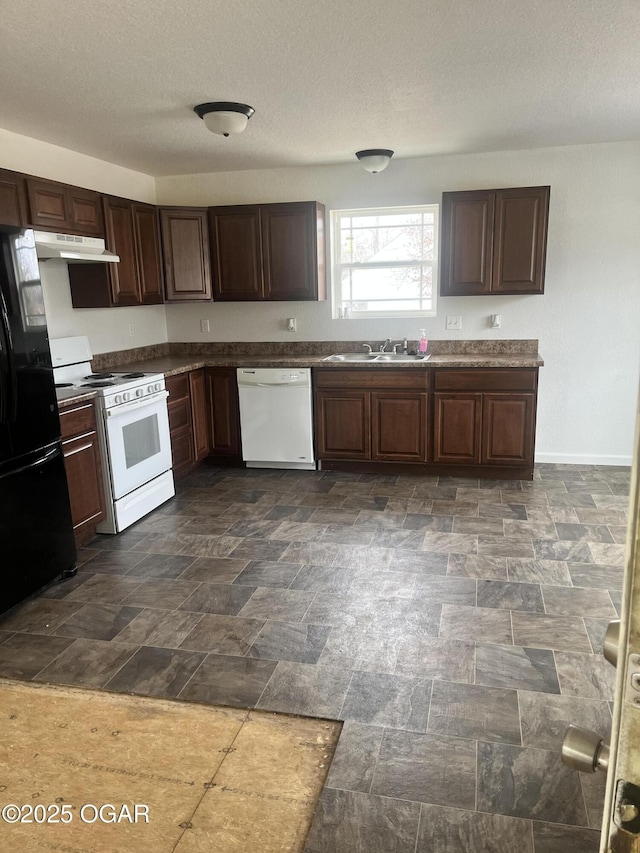 kitchen featuring dark brown cabinets, sink, a textured ceiling, and white appliances