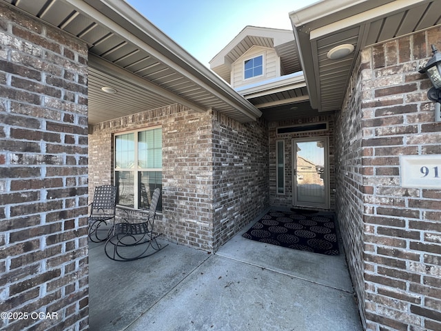 entrance to property featuring a patio area