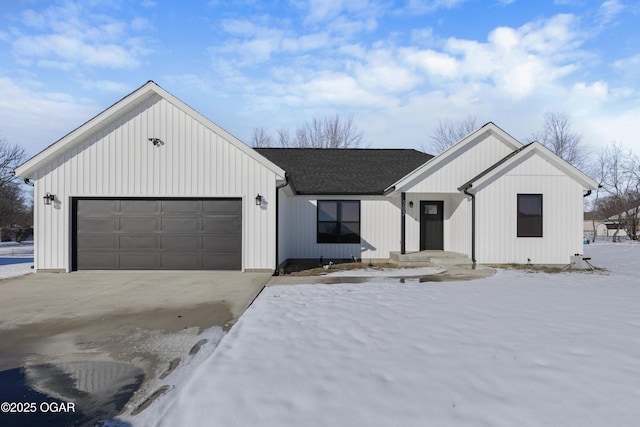 modern farmhouse style home featuring a garage