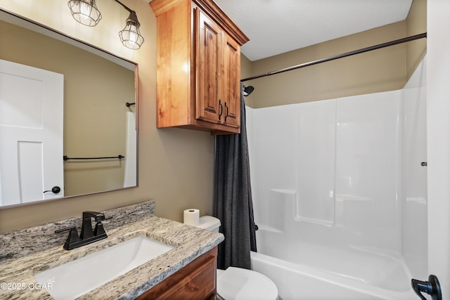 full bathroom with shower / tub combo, vanity, and toilet