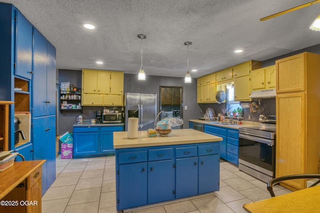 kitchen featuring appliances with stainless steel finishes, a textured ceiling, blue cabinetry, pendant lighting, and an island with sink