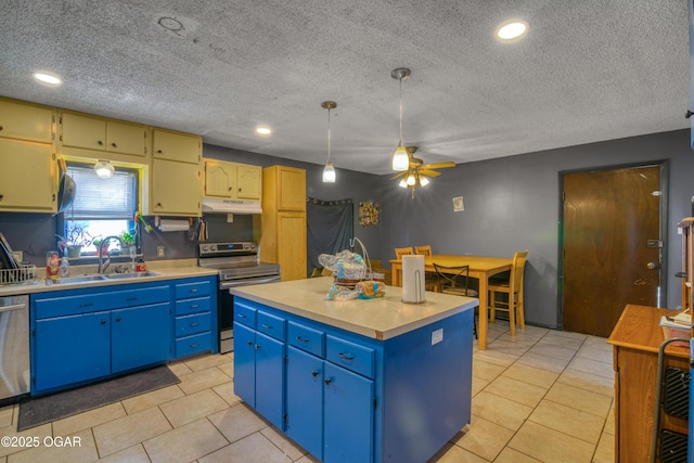 kitchen with appliances with stainless steel finishes, blue cabinets, sink, decorative light fixtures, and a center island