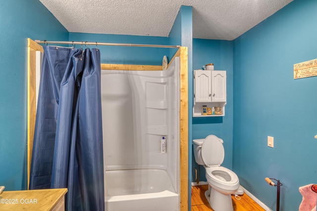 bathroom with toilet, shower / tub combo, a textured ceiling, and hardwood / wood-style flooring