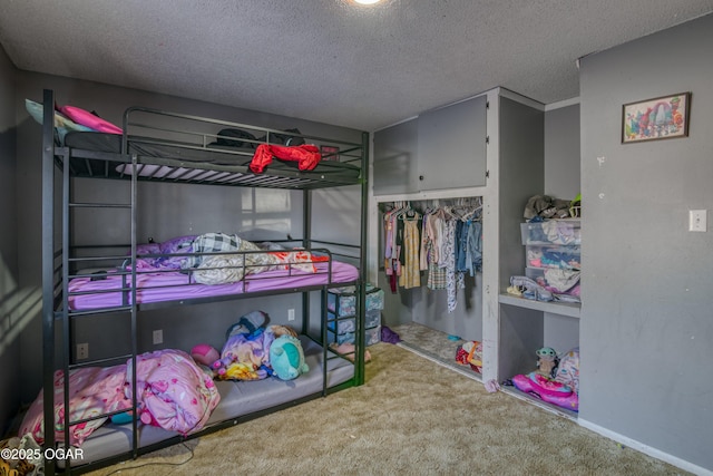 carpeted bedroom featuring a textured ceiling