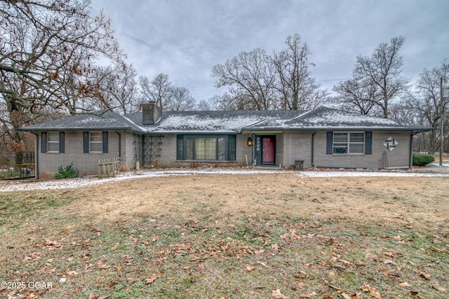 ranch-style house with a front lawn