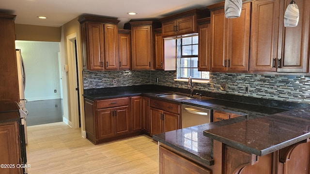 kitchen with tasteful backsplash, sink, a kitchen breakfast bar, stainless steel dishwasher, and kitchen peninsula