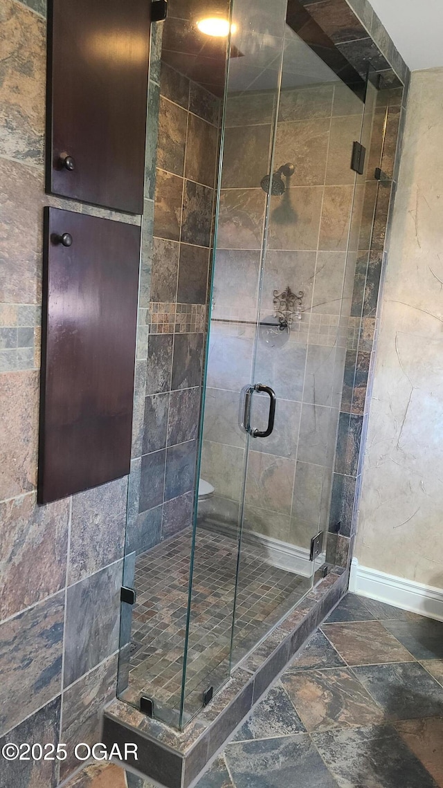 bathroom featuring an enclosed shower