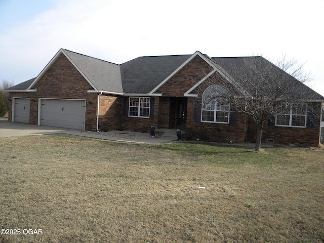 view of front facade with a front lawn and a garage