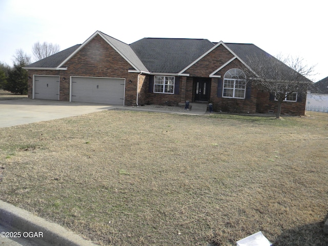 ranch-style house with a front yard and a garage