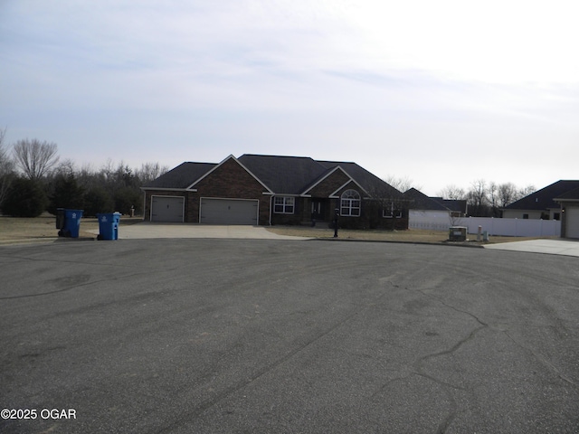 single story home with a garage