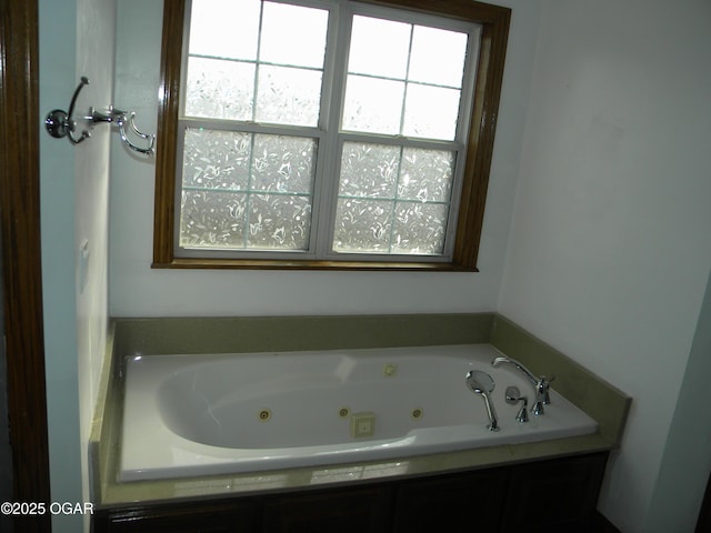 bathroom with tiled tub