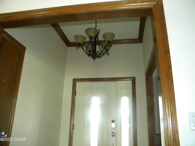 entrance foyer featuring a chandelier