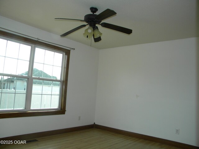 unfurnished room featuring ceiling fan and light hardwood / wood-style floors