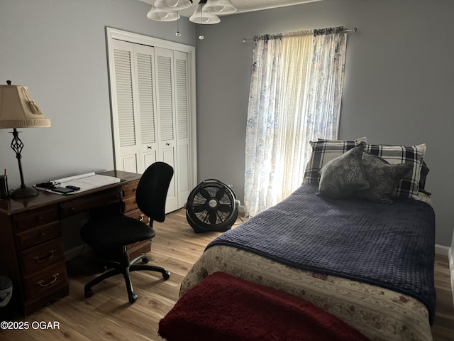 1019 Hawthorne St, Carthage, MO 64836 - bedroom featuring wood finished floors, a closet, and a desk