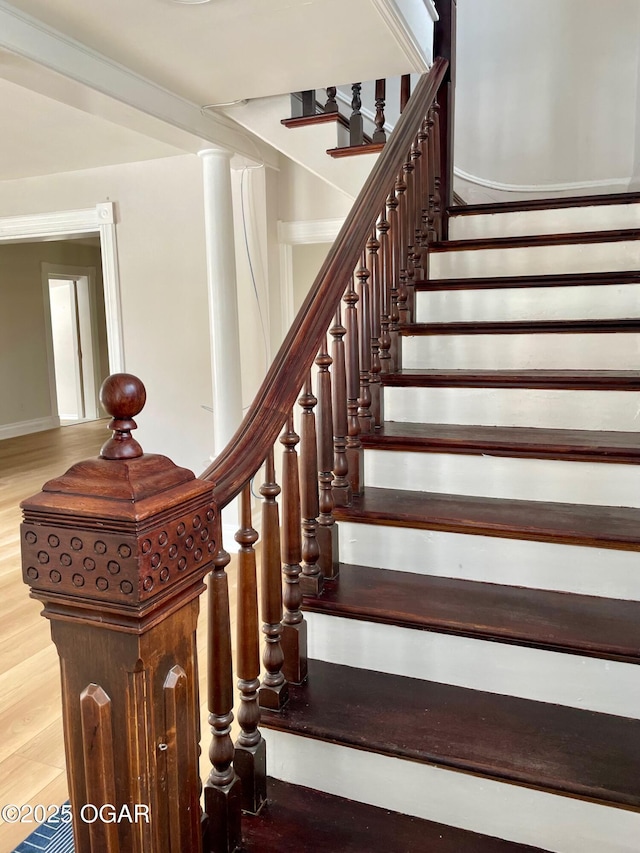 staircase featuring wood finished floors