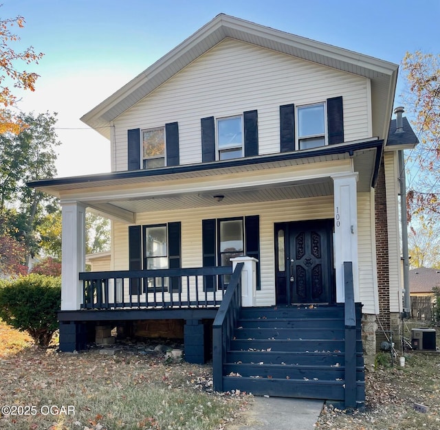 view of front of home with central air condition unit and covered porch