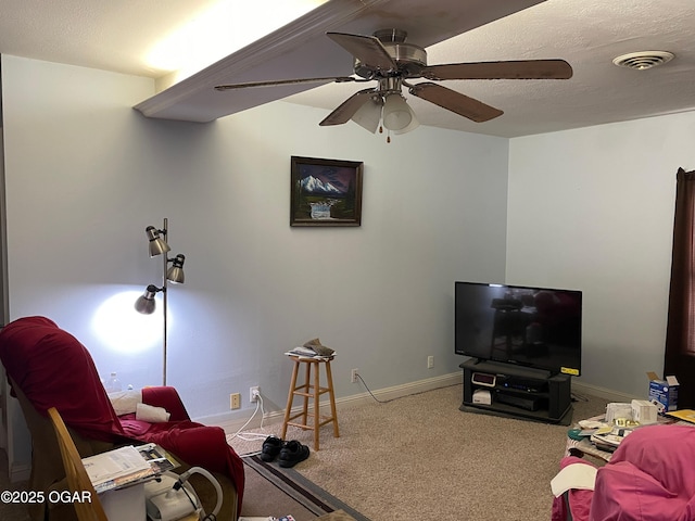 living room with carpet floors and ceiling fan