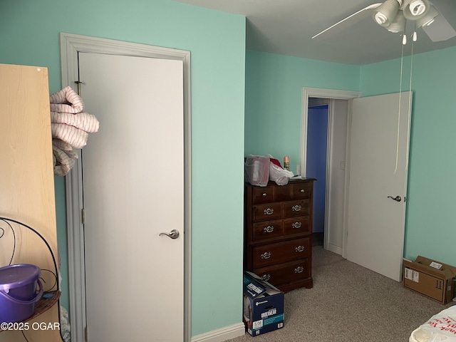 bedroom featuring ceiling fan and light colored carpet