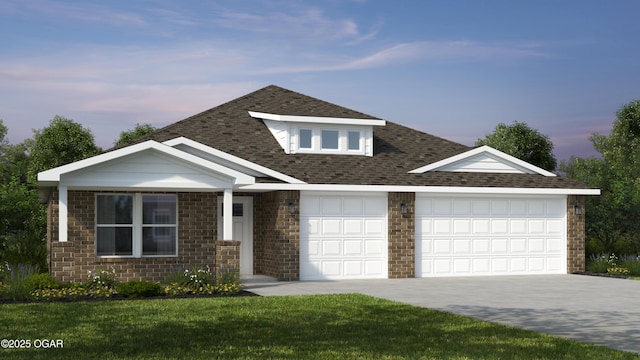 view of front of property featuring a lawn and a garage