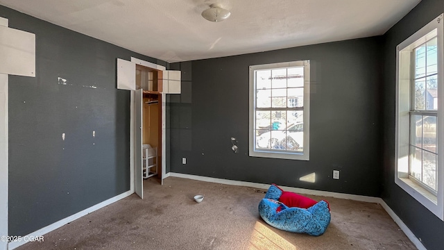 unfurnished bedroom featuring carpet flooring