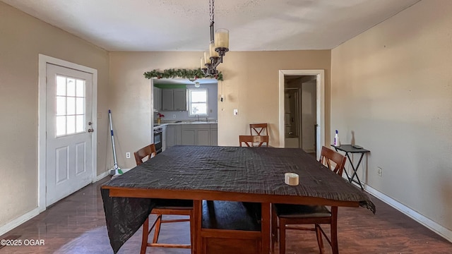 dining space with sink and a wealth of natural light