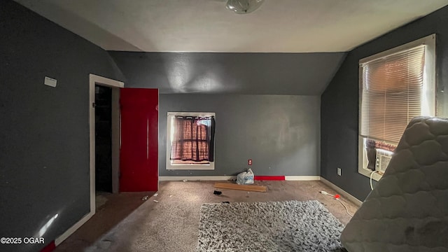 additional living space featuring cooling unit and vaulted ceiling