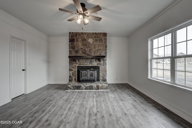 unfurnished living room featuring ceiling fan and hardwood / wood-style floors