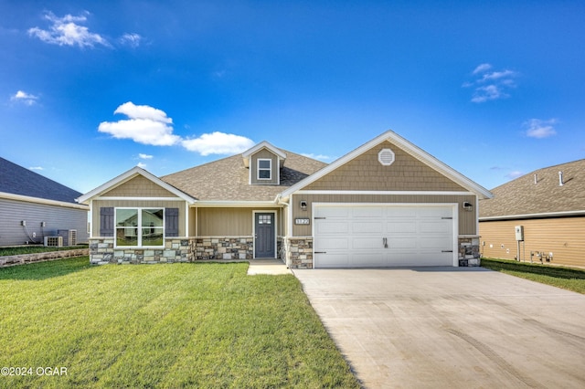 view of front of home featuring a front lawn and a garage