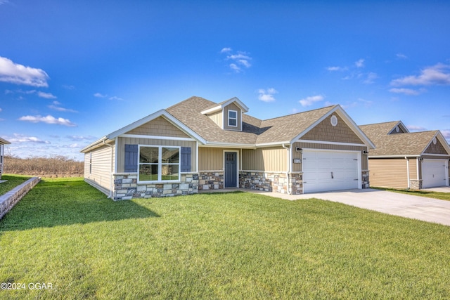 craftsman-style home featuring a garage and a front lawn