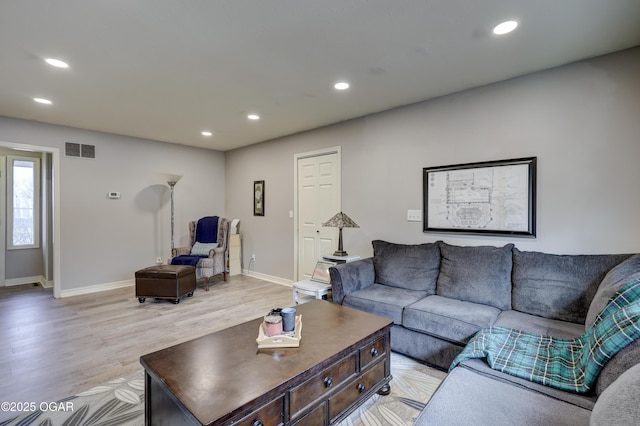 living room with light hardwood / wood-style floors