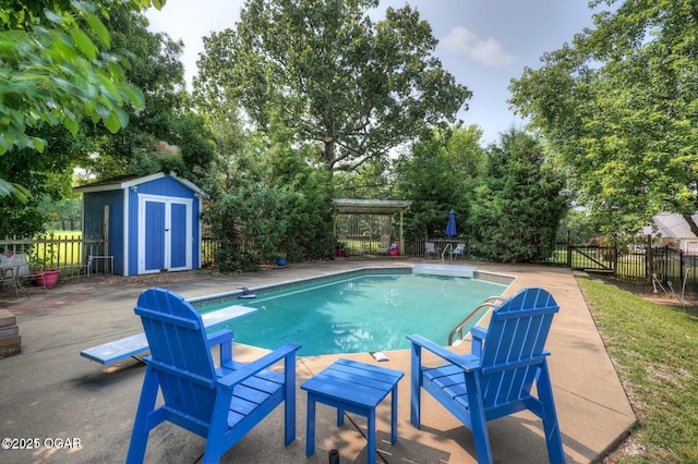 view of swimming pool with a diving board, a pergola, a patio area, and a storage unit