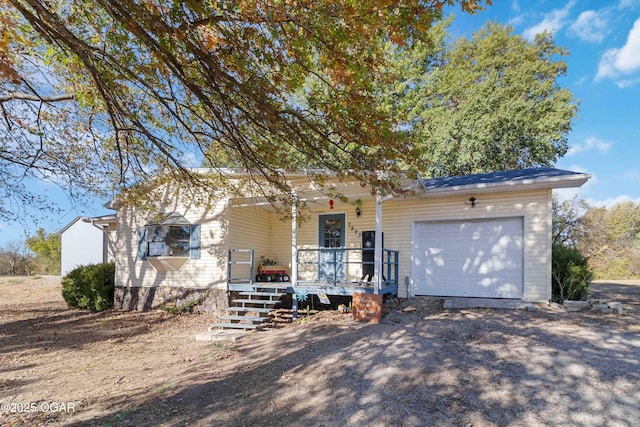 view of front of property with a garage and a porch