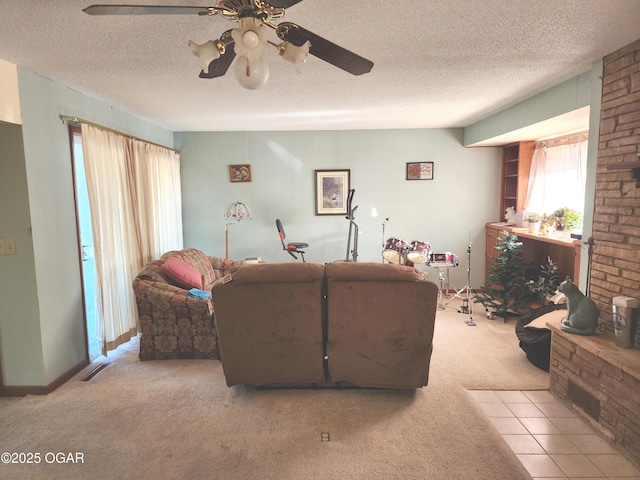 carpeted living room with ceiling fan and a textured ceiling