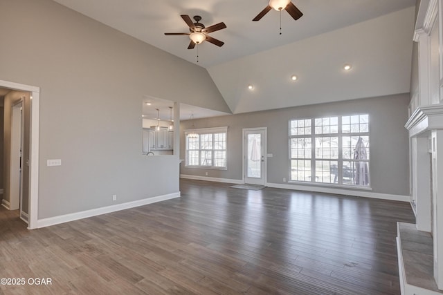 unfurnished living room featuring ceiling fan, dark wood-type flooring, and high vaulted ceiling